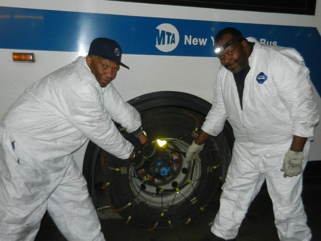 <p>Workers lashed bus tires with chains as the Metropolitan Transportation Authority prepared for Winter Storm Nemo to blast New York City on Friday Feb. 8, 2013.</p>
