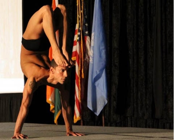 <p>World champion Joseph Encinia performed handstand scorpion pose.</p>
