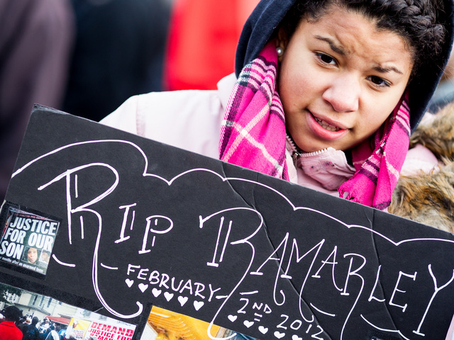 <p>A young girl carries a poster at the one-year anniversary rally for Ramarley Graham - the teenager who was gunned down by an NYPD officer - in the Bronx on Feb. 2, 2013.</p>
