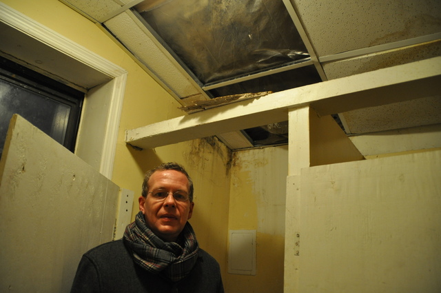 <p>Tenants Jeffrey Earnest, 41, stood under a broken ceiling in the bathroom of 1109 Manhattan Avenue.</p>
