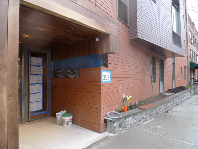 <p>The entrance to the new luxury rental building at 202 Eighth St., which will start renting apartments this weekend.</p>
