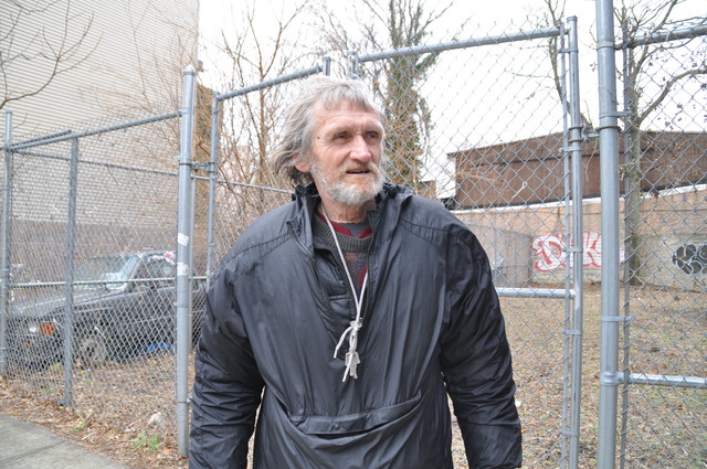 <p>Jerzy Sulek&nbsp;stood in front of the lot at 61 Franklin St., which local activists hope to turn into a community garden.</p>
