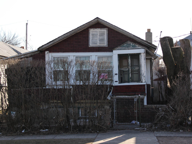 <p>Residents say they want the abandoned homes at 774 and 776 New Dorp Lane demolished, because they fear their structural integrity has worsened since Hurricane Sandy. March 5, 2013.</p>
