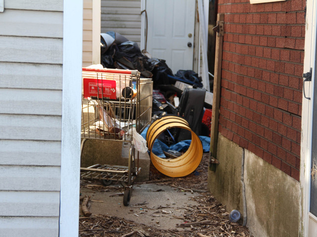 <p>The yard of 774 and 776 New Drop Lane has trash all over it. The houses have been abandoned for years and residents fear they are filled with mold and in danger of collapsing after additional Sandy damage, March 5, 2013.</p>
