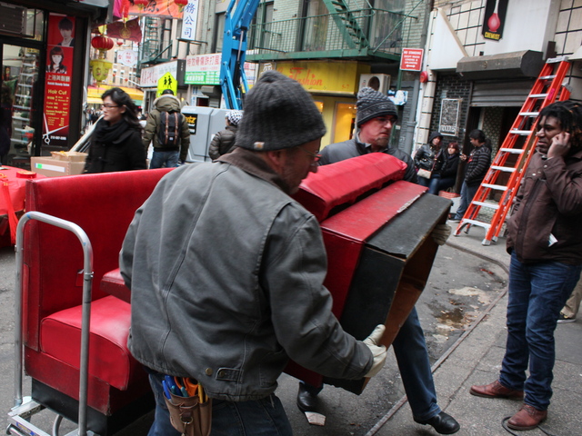 <p>Film crews move bench seats into the Nom Wah Tea Parlor ahead of filming for "The Amazing Spider-Man 2."</p>
