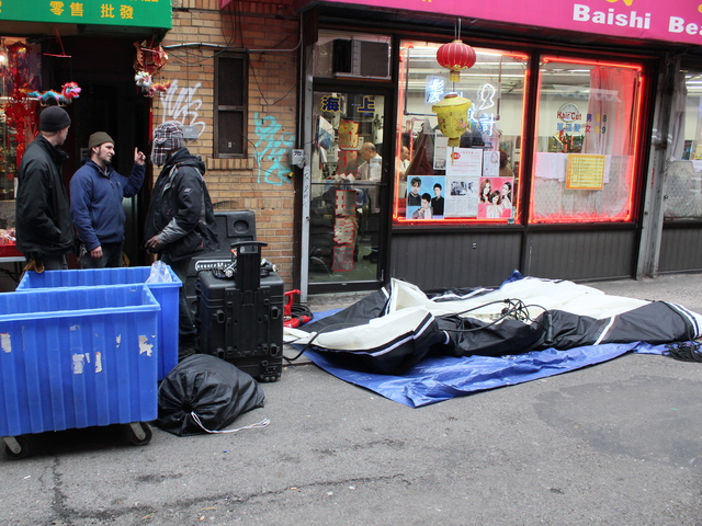 <p>Film crews prepare to put up lighting equipment to illuminate Doyers Street ahead of filming for "The Amazing Spider-Man 2."</p>
