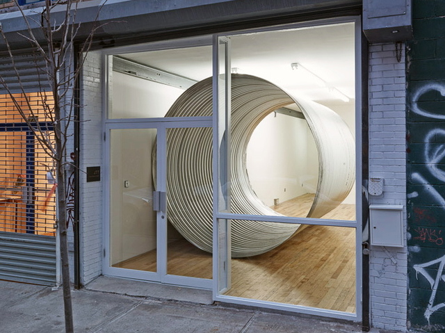<p>A metal pipe is the only artwork in Charles Harlan's exhibition "Cave."</p>
