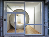 Art Scene Asks How to Fit a Large Metal Pipe in a Tiny Gallery 