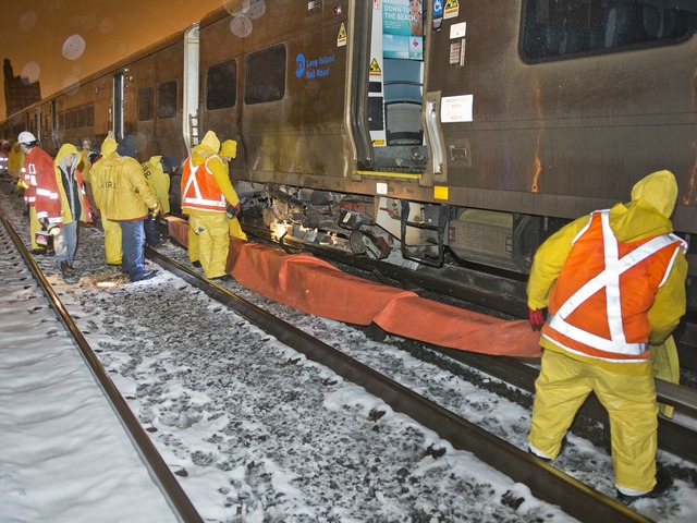 <p>Crews worked through the night to right a train that had fallen off the rails Monday March 18, 2013.</p>

