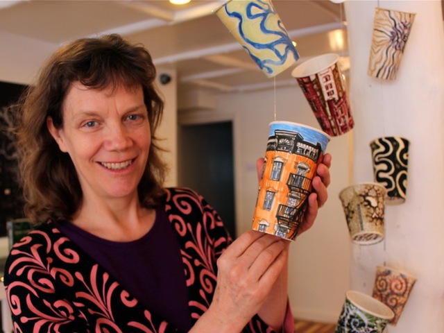 <p>Painter Gwenyth Leech sells painted coffee cups for $300 each. More than 200 of these are in display on West Eight Street through Saturday, March 23, 2013.</p>
