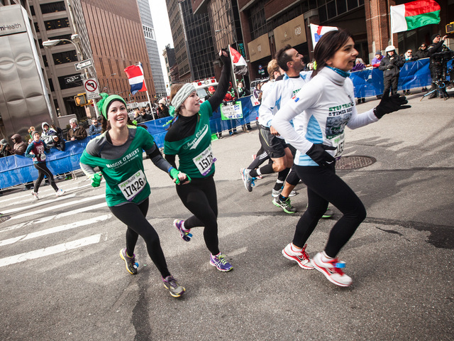 <p>A group of runners turn the final corner and head for the finish line at the annual NYC Half marathon on Mar. 17, 2013.</p>
