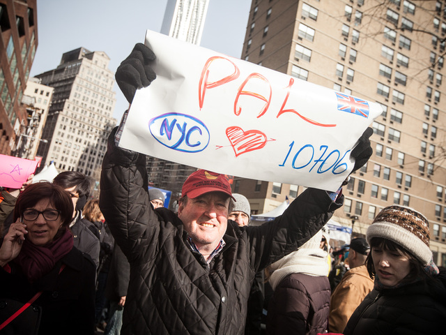 <p>Henry Zwicky, 65, an investment banker from NYC cheers on his daughter Alexandra at the 8th annual NYC Half marathon on Mar. 17, 2013.</p>
