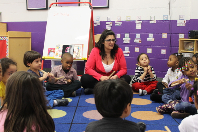 <p>Teacher Jenna Delia leads a class of 3- and 4-year-olds at the Hudson Guild's Early Childhood Education Program.</p>
