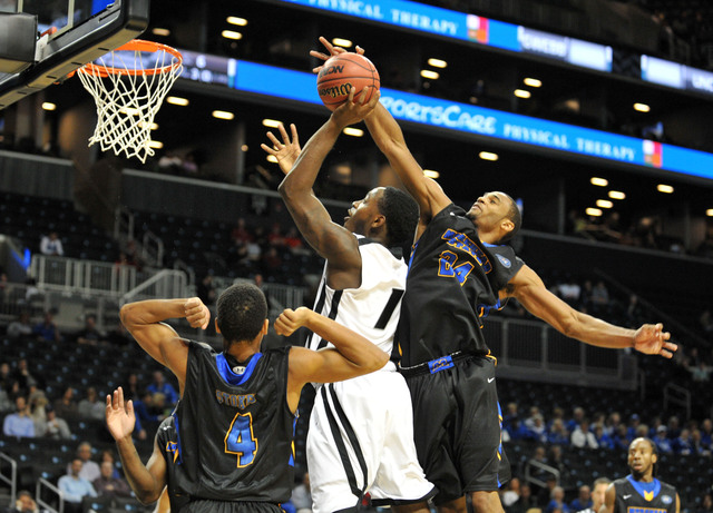 <p>Milton Chavis #24 of the Morehead State Eagles blocks Jamal Olasewere #1 of the LIU Brooklyn Blackbirds in the second half during the Barclays Center Classic at the Barclays Center.</p>
