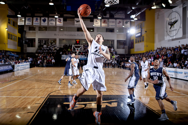 <p>Jason Brickman scores a layup against Mount St. Mary's in the NEC Tournament.</p>
