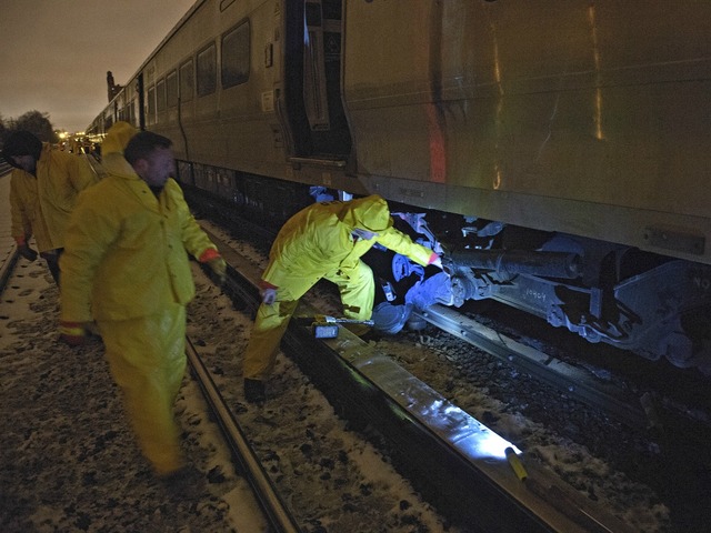 <p>Crews worked through Monday night and into Tuesday after a train derailed and damaged track, but it was unclear when they would be finished.</p>
