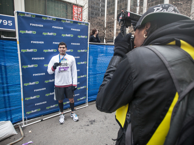 <p>A runner is photographed after successfully completing the annual NYC Half marathon on Mar. 17, 2013.</p>

