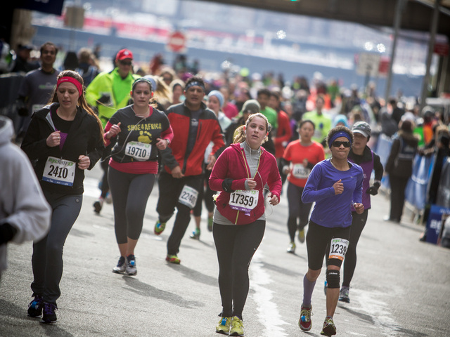 <p>Runners head towards the finishing line of the 8th annual NYC Half marathon in Lower Manhattan on Mar. 17th, 2013.</p>
