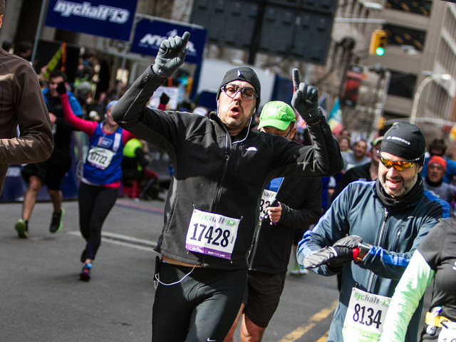 <p>A runner crosses the finish line of the 8th Annual NYC Half marathon at the South Street Seaport on Mar. 17th, 2013.</p>
