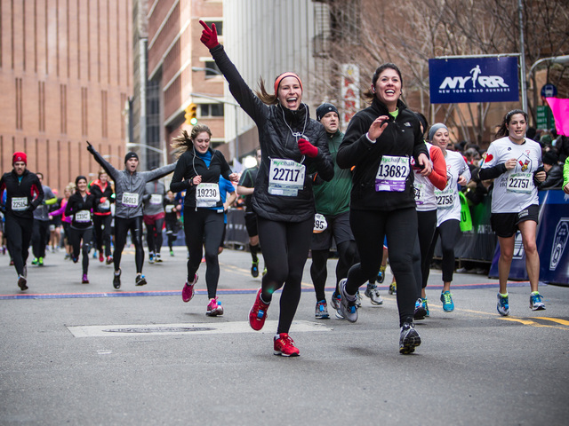 <p>Runners cross the finishing line at the 8th annual NYC Half marathon at the South Street Seaport on Mar. 17th, 2013.</p>
