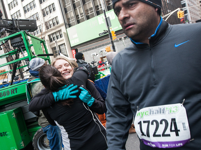 <p>Two runners embrace after crossing the finish line of the 8th NYC Half marathon at the South Street Seaport on Mar. 17, 2013.</p>
