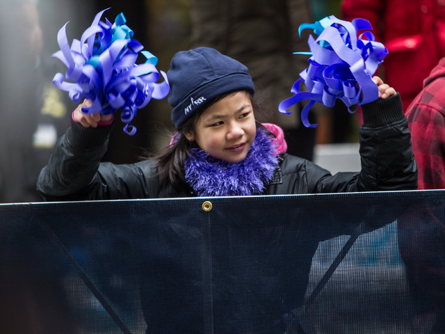 <p>A young girl watches the NYC Half marathon at the South Street Seaport in Lower Manhattan on Mar. 17th, 2013.</p>
