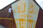 Sunnyside Mural Urges Graffiti-Plagued Corner to 'Rise-N-Shine'