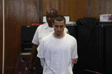 A stone-faced Elliot Morales pleaded not guilty to murder during his indictment in Manhattan Supreme Court on June 18, 2013.