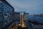 Glass Elevator With East River Views Rises at NYU Medical Center