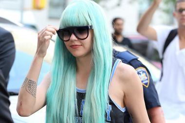 Amanda Bynes donned a new wig during her appearance in Manhattan Criminal Court Tuesday, July 9, 2013, on charges she threw a bong out of the window of her high-rise Midtown apartment