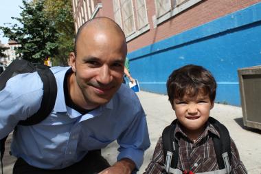 Malcolm Hansen, 44, a graduate student outside of P.S. 125 Ralph Bunche Elementary with is son Wren, 3, after his first day of pre-K.