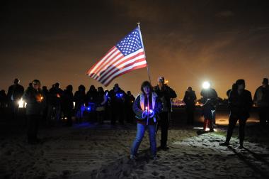 Staten Island residents commemorate Hurricane Sandy, one year later, on the shoreline in Midland Beach on October 29, 2013