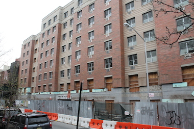 The troubled Abyssinian Development Corporation is on track to restart construction on a half-finished low income housing development in Central Harlem that has lay fallow for almost a year, said the Rev. Calvin Butts , pastor of Abyssinian Baptist Church. But neighbors on 123rd Street between Adam Clayton Powell Jr. Boulevard and Frederick Douglass Boulevard say they'll believe it when they see it.
