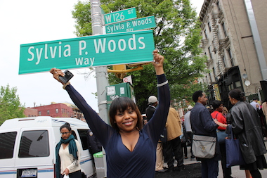 The plan to name 126th Street at Lenox Avenue after the late soul food restaurateur Sylvia Woods had been in the works years before she passed away in 2012. But in many ways, Woods, known as the "Queen of Soul Food," had long-ago placed her stamp on Harlem. "Famous people become well known. Great people make things bigger than their own name and personality," activist and talk show host the Rev. Al Sharpton said Wednesday morning at ceremony renaming the street "Sylvia P. Woods Way."
