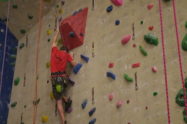 Adam Payne has a neuromuscular condition that requires him to use leg braces or a wheelchair. In spite of that, he is pursuing competitve rock climbing.