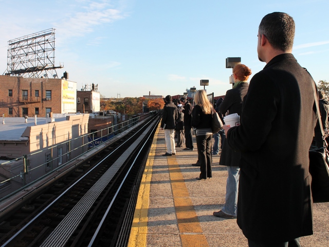 <p>Commuters wait for the N train at Astoria Boulevard in Queens on Thursday, as some subway lines resumed service for the first time since shutting down on Sunday before Hurricane Sandy.</p>
