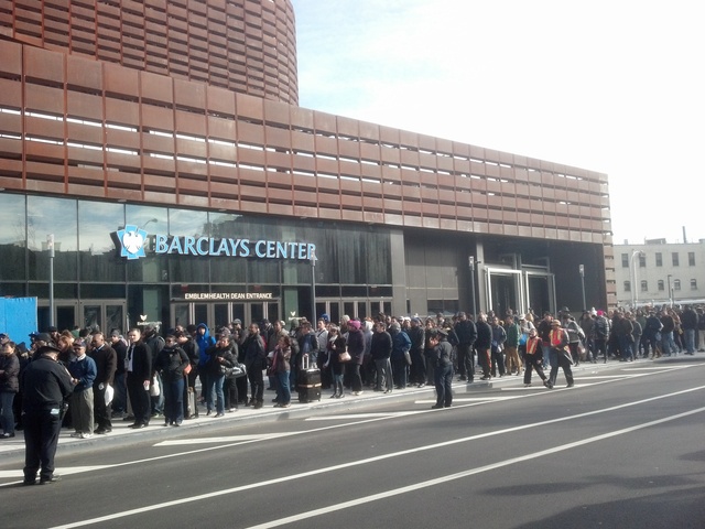 <p>Commuters brave long lines at the Barclays Center waiting for a bus into Manhattan on November 1, 2012. As the city resumes transportation services, straphangers are reporting long waits.</p>
