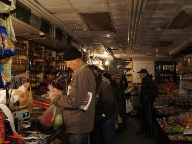 Shoppers crowded stores along Brighton Beach Avenue Wednesday despite flooding and continued blackouts.