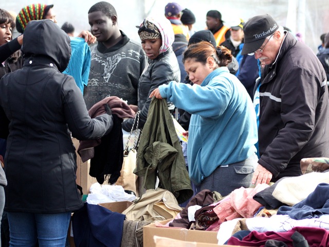 <p>Coney Island residents receive clothes in the aftermath of Hurricane Sandy.</p>
