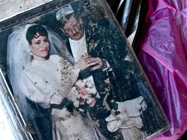 <p>November 6, 2012 - A muddy wedding photo sits at the top of a cardboard box in Sea Gate.</p>
