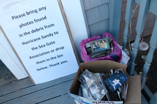<p>November 6, 2012 -Smiling faces from shots of weddings, baptisms, graduations and family vacations sit in cardboard boxes near a sign that reads "Please bring any photographs found in the debris of Hurricane Sandy to the Sea Gate Association or drop them in the bin."</p>
