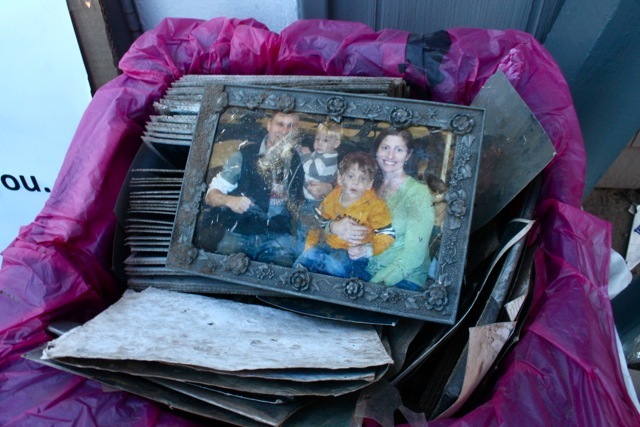 <p>November 6, 2012 - A family photograph sat in a cardboard box outside the Sea Gate chapel.</p>
