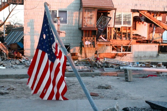 <p>November 6, 2012 - A flag flies near a damaged home in Sea Gate.</p>
