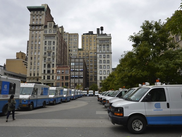 <p>Con Ed trucks staged in a parking lot ahead of Hurricane Sandy.</p>

