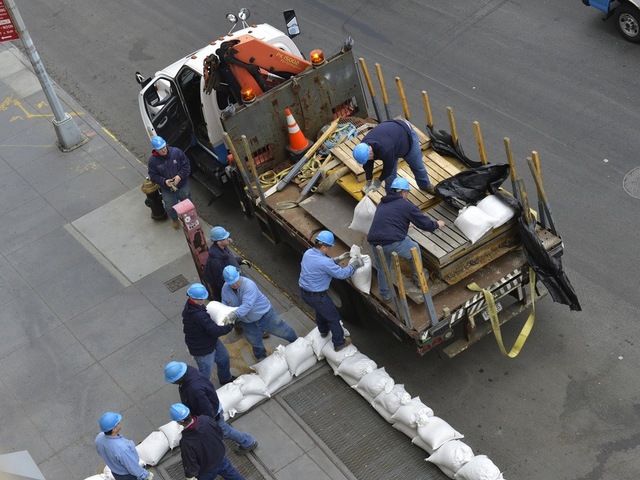 <p>Con Ed workers sandbag a facility ahead of Hurricane Sandy.</p>
