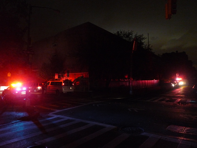 <p>The flashing lights of NYPD patrol cars were some of the few lights on the Lower East Side after Hurricane Sandy knocked out power.</p>
