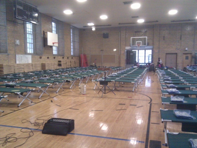 <p>An emergency shelter at Seward Park High School on the Lower East Side set up dozens of cots in preparation for Hurricane Sandy, Oct. 28, 2012.</p>
