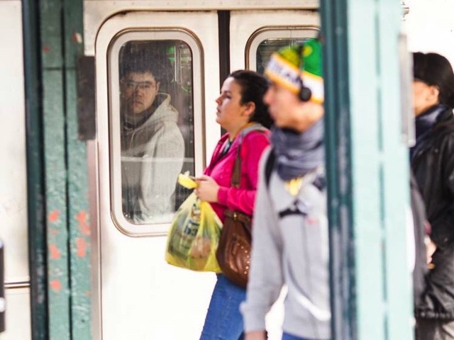 <p>A commuter looks out from a crowded subway train Monday morning, Nov. 5, 2012, one week after Hurricane Sandy crippled the region's mass transit system.</p>
