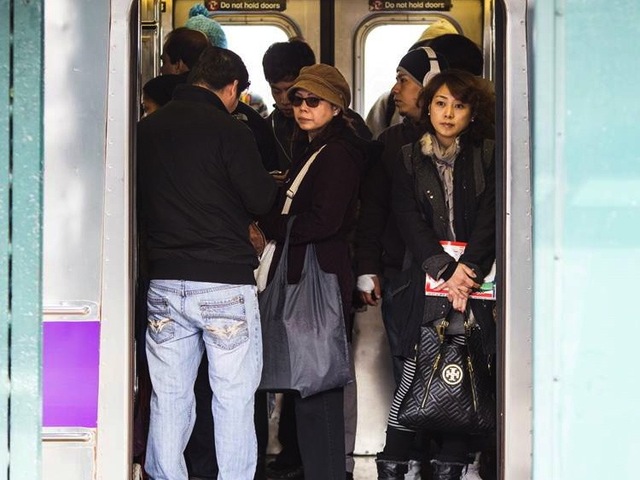 <p>Commuters board a crowded subway train Monday morning, Nov. 5, 2012, one week after Hurricane Sandy crippled the region's mass transit system.</p>

