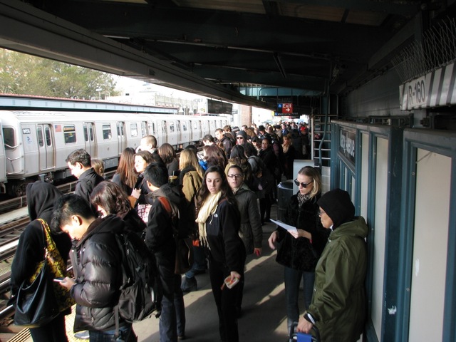 <p>A commuter wait on a crowded subway platform Monday morning, Nov. 5, 2012, one week after Hurricane Sandy crippled the region's mass transit system.</p>
